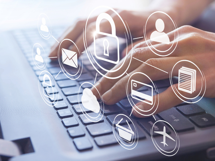 Hands typing on computer with icons representing privacy and security